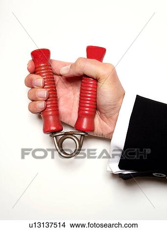 Picture - Hand squeezing a handgrip. Fotosearch