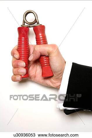 Hand squeezing a handgrip View Large Photo Image Stock Image - Hand squeezing a handgrip. Fotosearch