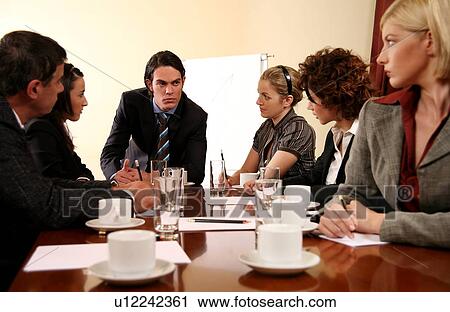 A group of business people at a meeting View Large Photo Image Stock Image - A group of business people at a meeting. Fotosearch