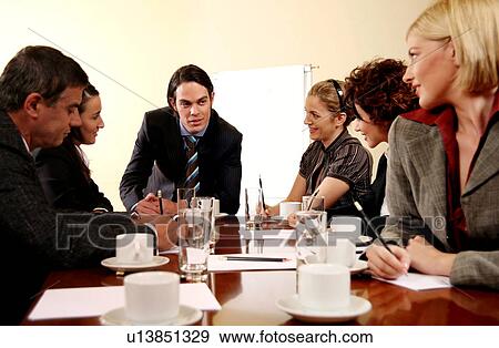 A group of business people at a meeting View Large Photo Image Stock Photo - A group of business people at a meeting. Fotosearch