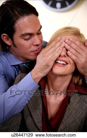 Business couple playing around in the office View Large Photo Image Stock Photo - Business couple playing around in the office. Fotosearch