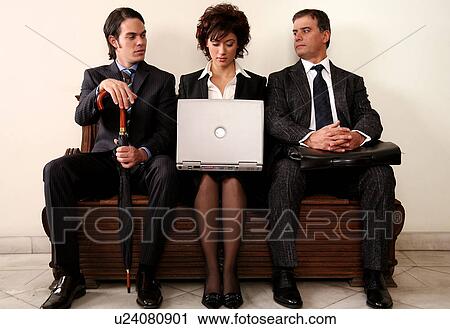Three people sitting in a waiting room View Large Photo Image Stock Image - Three people sitting in a waiting room. Fotosearch