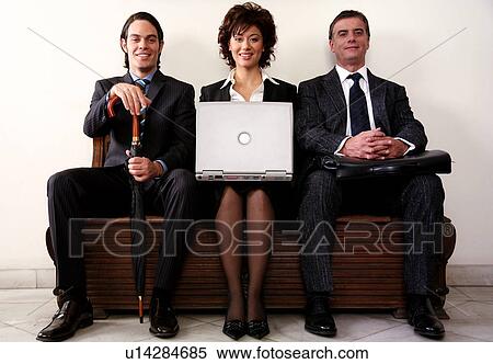 Stock Photography -  Three people sitting in a waiting room. Fotosearch