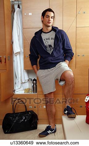 Man in locker room after work out View Large Photo Image Stock Photo - Man in locker room after work out . Fotosearch