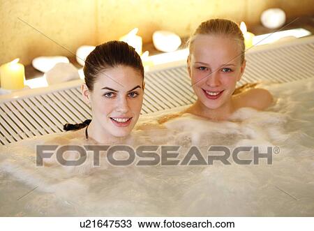 Two women in jacuzzi at a spa View Large Photo Image Stock Image - Two women in jacuzzi at a spa. Fotosearch