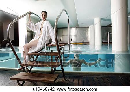 Young couple in a swimming pool at a spa View Large Photo Image Stock Image - Young couple in a swimming pool at a spa. Fotosearch