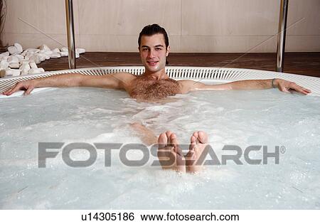 Young man in jacuzzi at a spa View Large Photo Image Stock Photograph - Young man in jacuzzi at a spa. Fotosearch