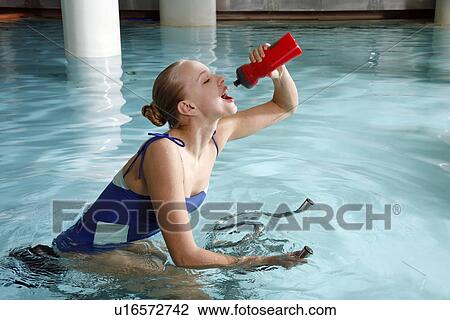 Young woman on exercise bike in spa pool View Large Photo Image Stock Image - Young woman on exercise bike in spa pool. Fotosearch