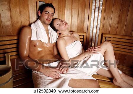 Stock Photo - A couple enjoying a sauna together. Fotosearch