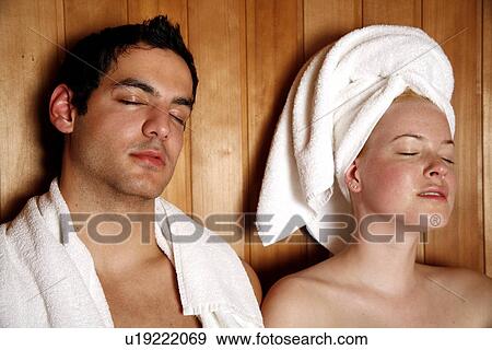 Stock Photo - A couple enjoying a sauna together. Fotosearch