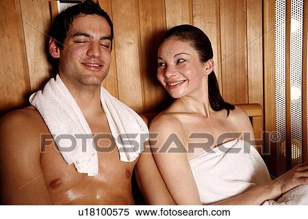 Stock Photography - A couple enjoying a sauna together. Fotosearch