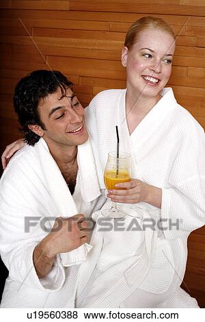 Stock Photo - A couple having a refreshment after a spa treatment. Fotosearch