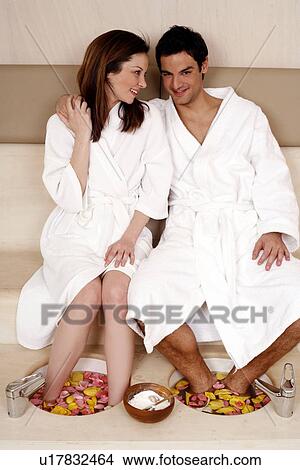 A young couple enjoying a foot bath with rose petals View Large Photo Image Picture - A young couple enjoying a foot bath with rose petals. Fotosearch