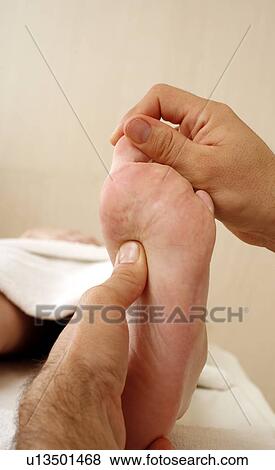 Foot massage View Large Photo Image Stock Photo - Foot massage. Fotosearch