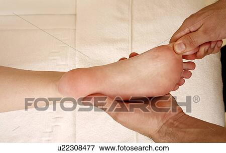 Stock Photo - Foot massage. Fotosearch