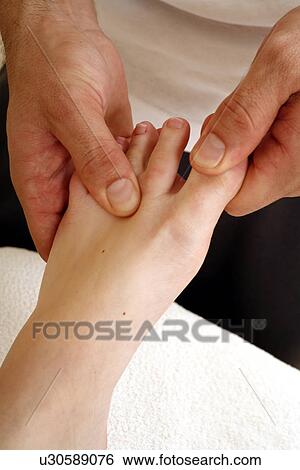 Foot massage View Large Photo Image Stock Photograph - Foot massage. Fotosearch