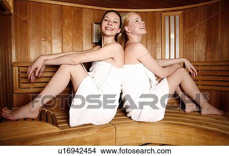 Two young women enjoying a sauna View Large Photo Image Picture - Two young women enjoying a sauna. Fotosearch