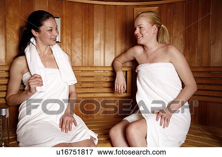 Stock Photo - Two young women enjoying a sauna. Fotosearch