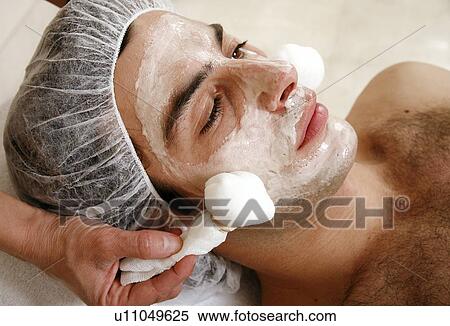 Stock Photography - Man having a facial treatment in a spa. Fotosearch
