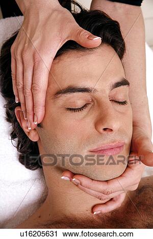 Stock Image - Man having facial massage. Fotosearch
