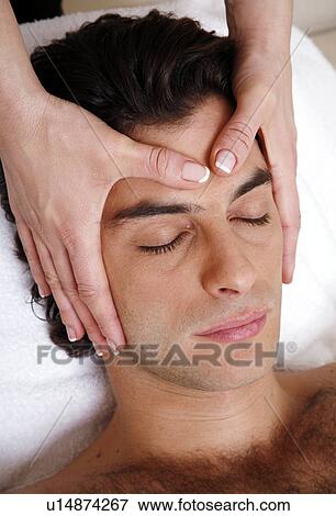 Stock Photo - Man having facial massage. Fotosearch