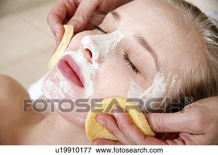 Woman having a facial treatment in a spa View Large Photo Image Stock Photo - Woman having a facial treatment in a spa. Fotosearch