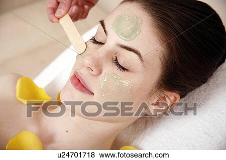 Woman having a facial treatment in a spa View Large Photo Image Stock Photo - Woman having a facial treatment in a spa. Fotosearch