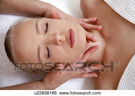 Stock Photograph - Woman having facial massage. Fotosearch