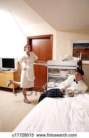 Hotel maid and waiter taking a break View Large Photo Image Stock Photography - Hotel maid and waiter taking a break. Fotosearch