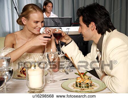 Couple having a romantic dinner in a restaurant View Large Photo Image Stock Photo - Couple having a romantic dinner in a restaurant. Fotosearch