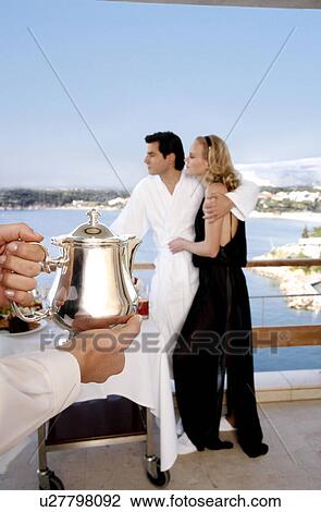 Couple having breakfast on hotel terrace View Large Photo Image Stock Image - Couple having breakfast on hotel terrace. Fotosearch