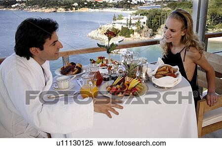 Couple having breakfast on hotel terrace View Large Photo Image Stock Photography - Couple having breakfast on hotel terrace. Fotosearch
