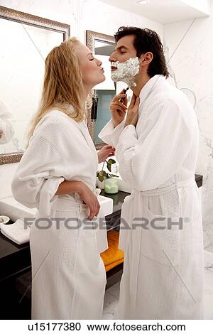 Couple sharing bathroom together View Large Photo Image Stock Image - Couple sharing bathroom together. Fotosearch