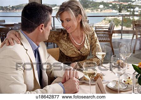 Stock Photo - Mature couple dining in a restaurant. Fotosearch
