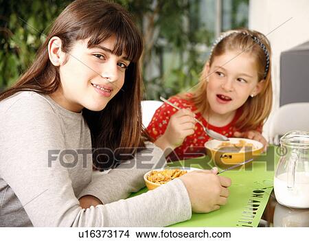 Children eating breakfast View Large Photo Image Picture - Children eating breakfast. Fotosearch