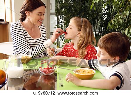 Father and children eating breakfast View Large Photo Image Stock Image - Father and children eating breakfast. Fotosearch