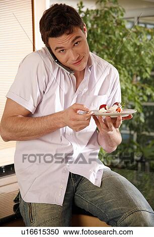 Man eating his breakfast View Large Photo Image Stock Image - Man eating his breakfast. Fotosearch