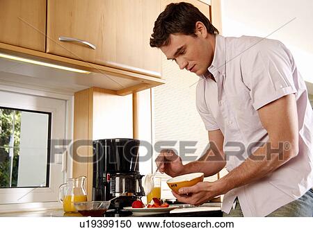 Man eating his breakfast View Large Photo Image Stock Image - Man eating his breakfast. Fotosearch