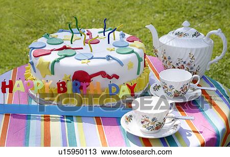Birthday cake with teapot and cups View Large Photo Image Stock Image - Birthday cake with teapot and cups. Fotosearch
