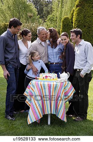 Stock Image - Family celebrating a birthday. Fotosearch