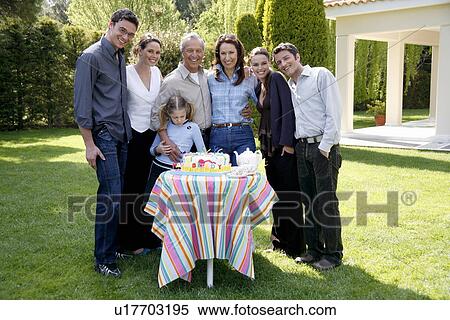 Stock Photography - Family celebrating a birthday. Fotosearch