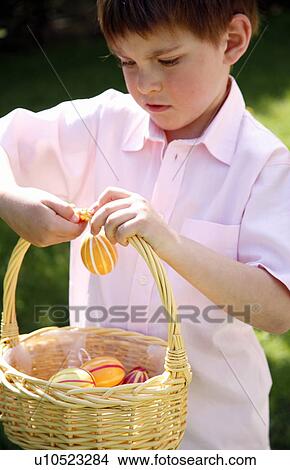 Picture - Little boy with Easter egg basket. Fotosearch