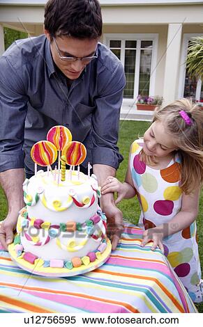 Stock Photography - Man holding party cake. Fotosearch