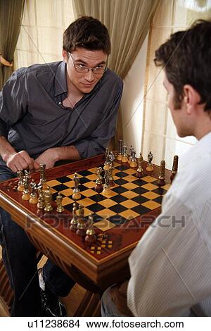 Two men playing chess View Large Photo Image Picture - Two men playing chess. Fotosearch