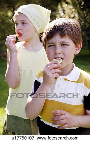 Children eating potato chips View Large Photo Image Stock Photo - Children eating potato chips. Fotosearch