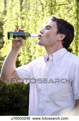 Stock Photograph - Man drinking a beer. Fotosearch