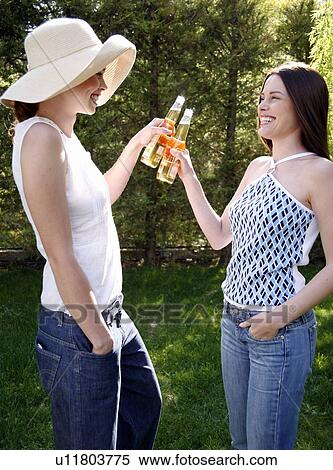 Two women drinking beer View Large Photo Image Stock Photography - Two women drinking beer. Fotosearch