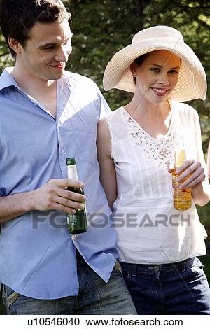 Young couple drinking beer View Large Photo Image Stock Image - Young couple drinking beer. Fotosearch