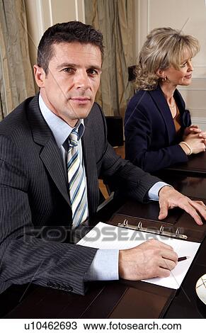 Stock Image - Business people having a meeting . Fotosearch