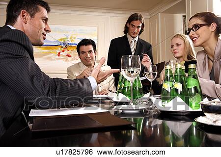 Business people having a meeting View Large Photo Image Stock Photograph - Business people having a meeting . Fotosearch